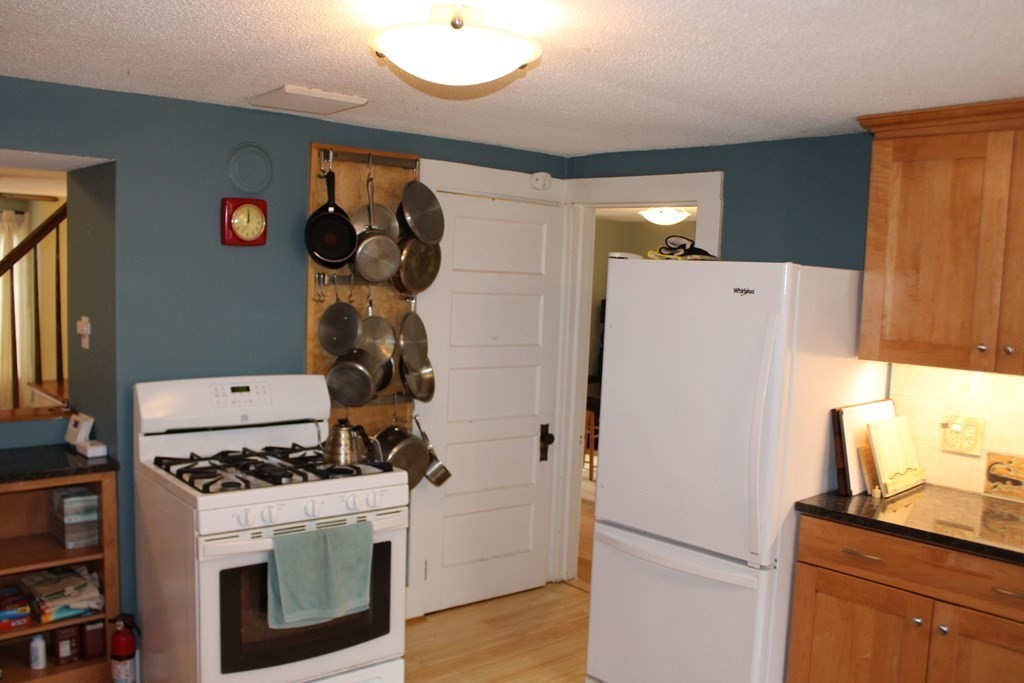 550 Bridge Road Northampton, MA 01062 - Photo 5 of 23 a kitchen with a refrigerator and a stove