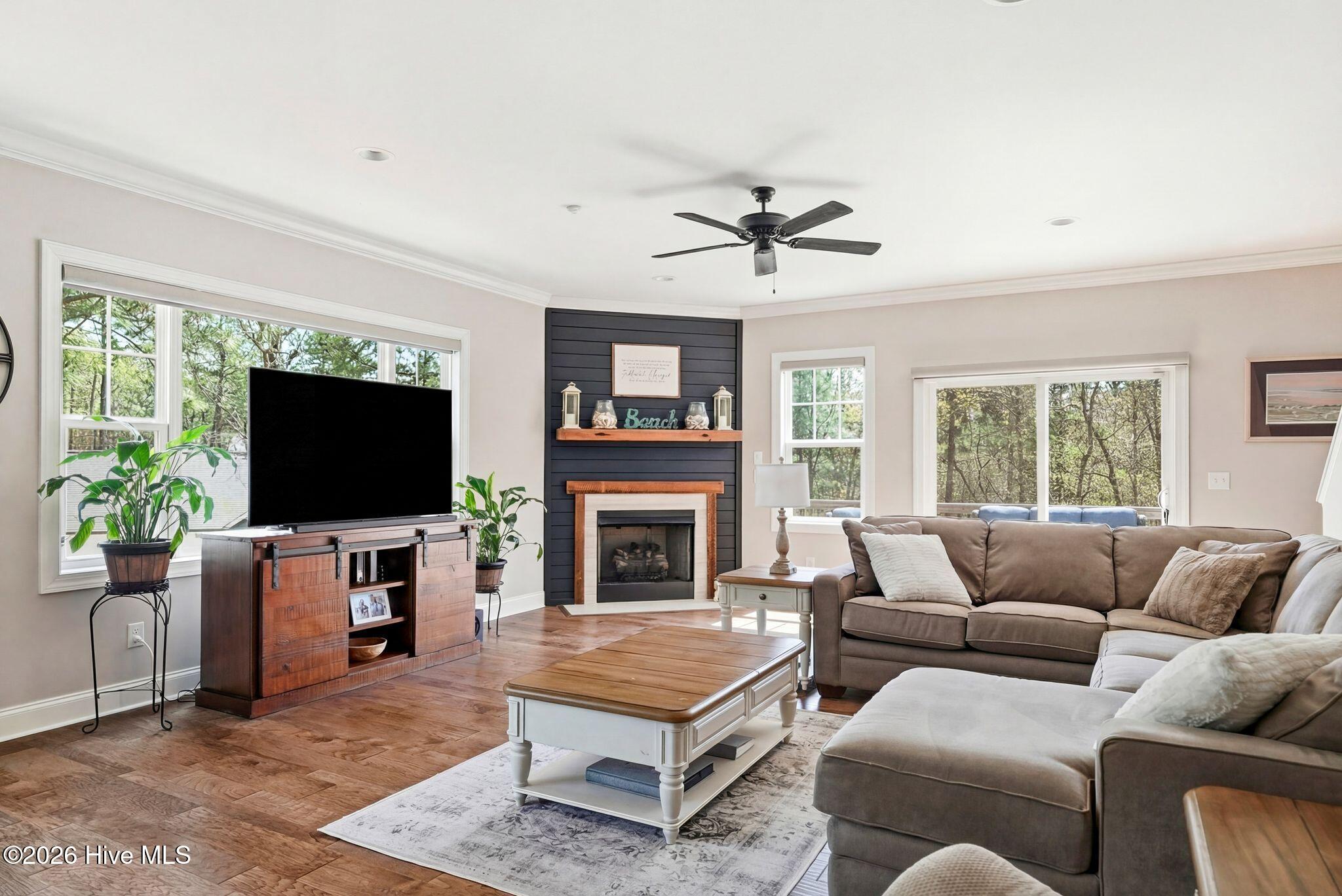 121 Longleaf Drive West End, NC 27376 - Photo 8 of 68 Living room with gas fireplace and water views!