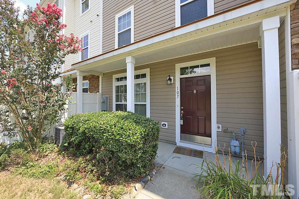 11701 Coppergate Drive, Unit 107 Raleigh, NC 27614 - Photo 2 of 13 front view of a brick house with a large windows