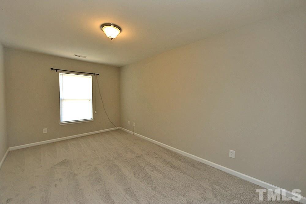 11701 Coppergate Drive, Unit 107 Raleigh, NC 27614 - Photo 11 of 13 a view of an empty room with a window
