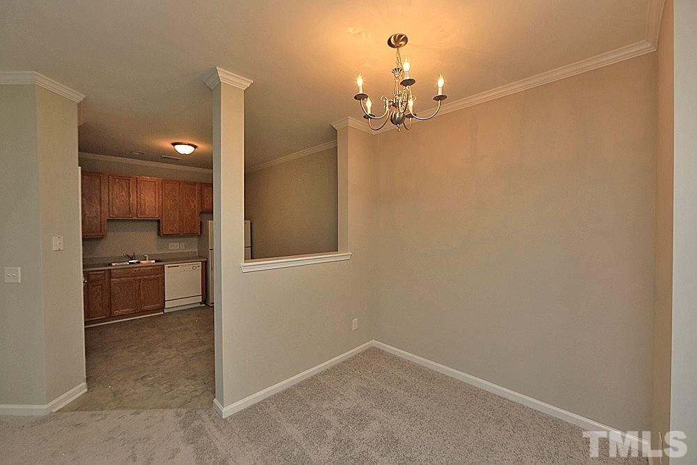 11701 Coppergate Drive, Unit 107 Raleigh, NC 27614 - Photo 4 of 13 a view of a livingroom with a kitchen