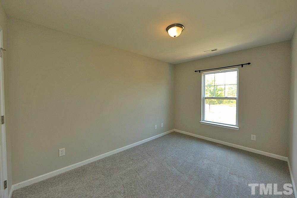 11701 Coppergate Drive, Unit 107 Raleigh, NC 27614 - Photo 10 of 13 an empty room with a window