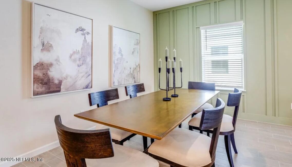 3203 Tupelo Loop Green Cove Springs, FL 32043 - Photo 12 of 22 a view of a dining room with furniture and window
