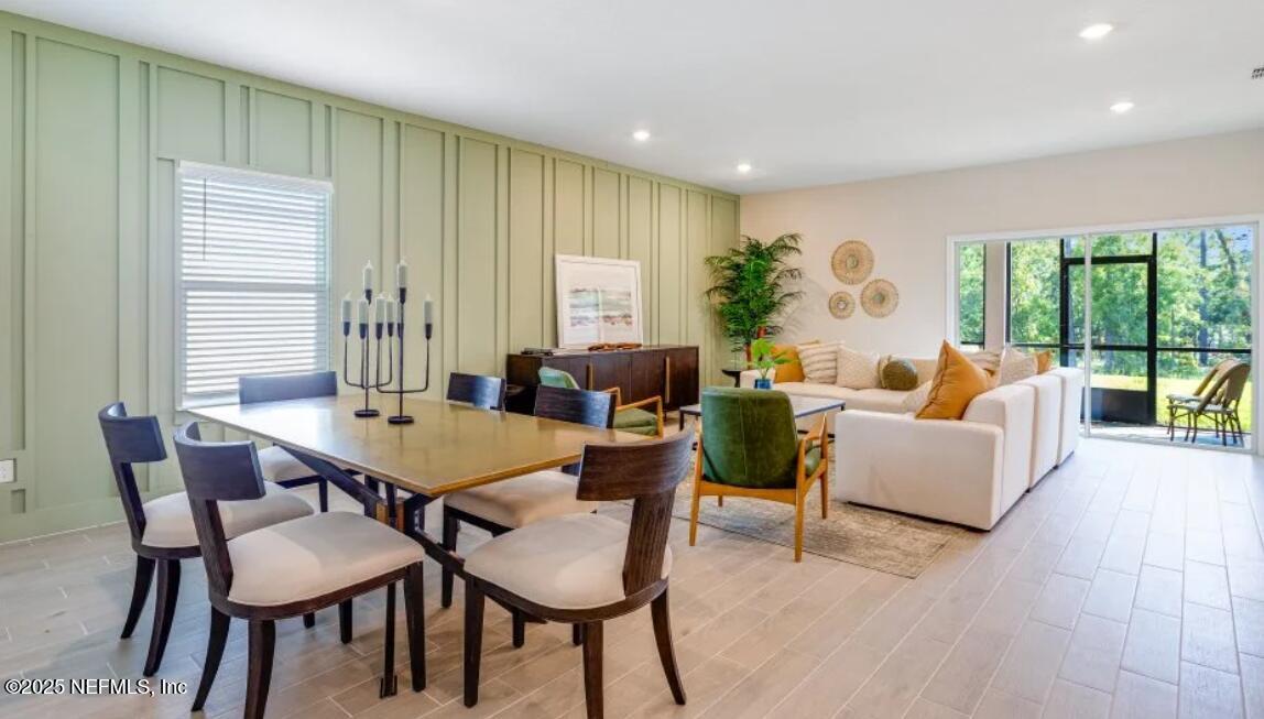 3203 Tupelo Loop Green Cove Springs, FL 32043 - Photo 20 of 22 a dining room with furniture and wooden floor