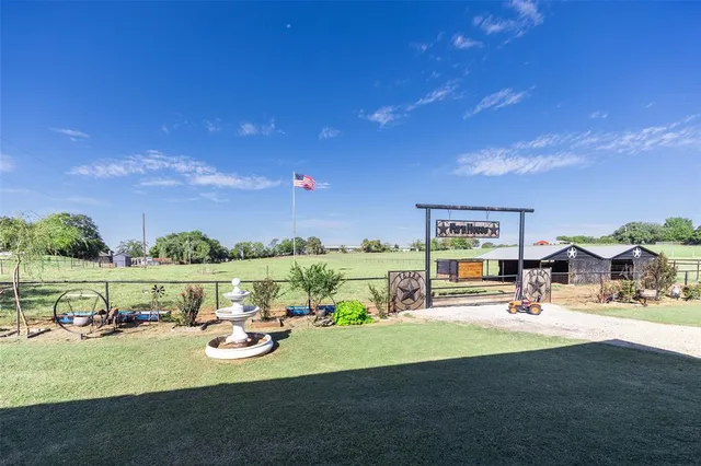 a house with yard in front of it