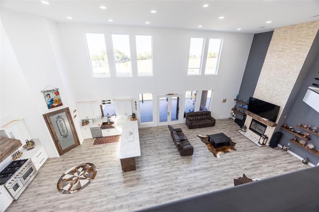 2630 Rockhill Road Aubrey, TX 76227 - Photo 27 of 38 a living room with furniture and a wooden floor