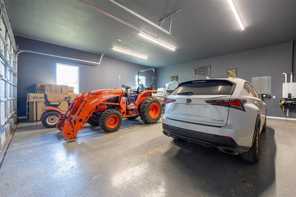 2630 Rockhill Road Aubrey, TX 76227 - Photo 28 of 38 a car is parked in a room