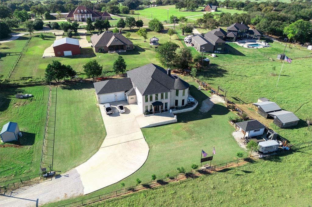 2630 Rockhill Road Aubrey, TX 76227 - Photo 29 of 38 an aerial view of a house with a garden and lake view