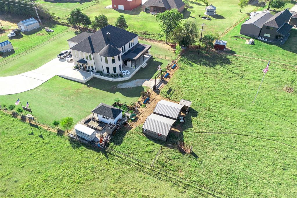 2630 Rockhill Road Aubrey, TX 76227 - Photo 30 of 38 an aerial view of a house with outdoor space patio and swimming pool