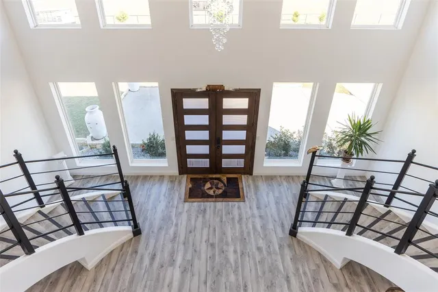 a view of a kitchen with dining room and wooden floor