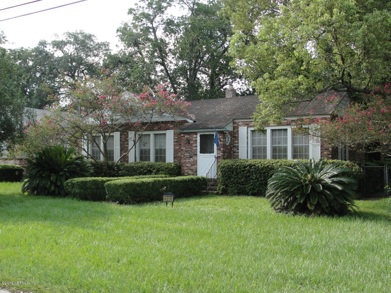 4656 Manchester Road Jacksonville, FL 32210 - Photo 1 of 31 a view of a house with backyard and garden