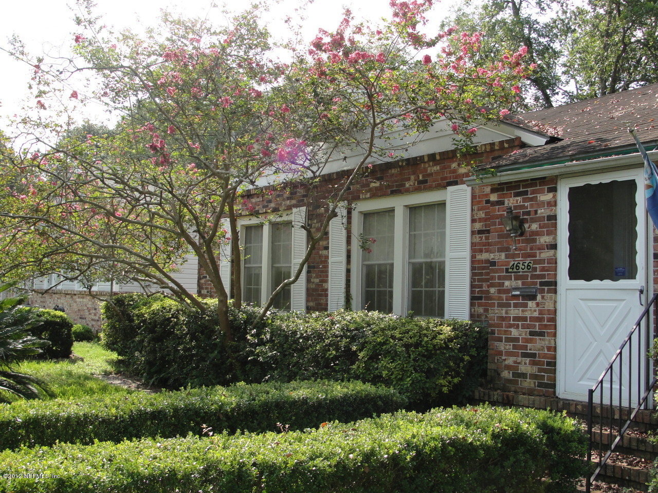 4656 Manchester Road Jacksonville, FL 32210 - Photo 2 of 31 a front view of a house with a yard