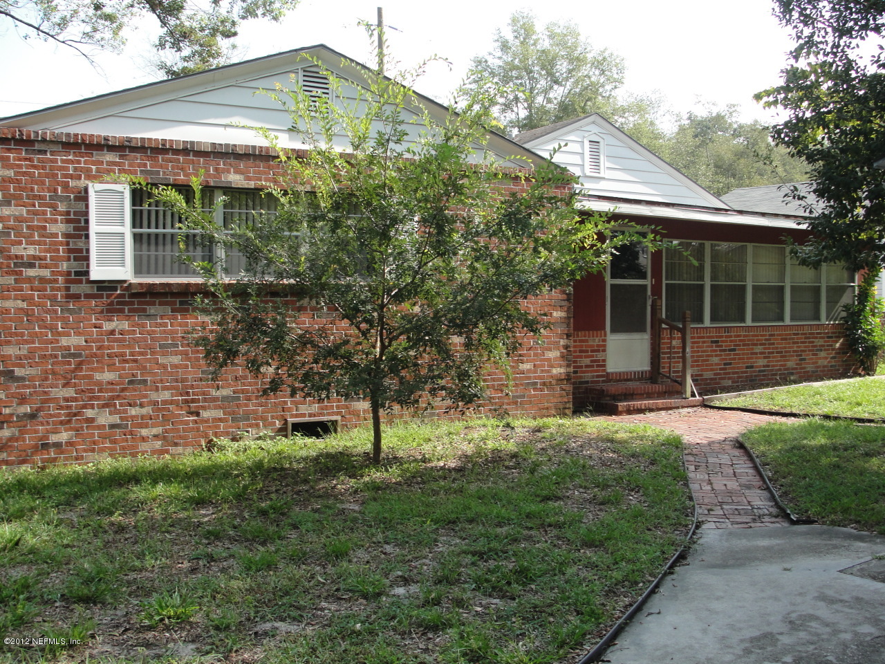 4656 Manchester Road Jacksonville, FL 32210 - Photo 22 of 31 a front view of house with a garden