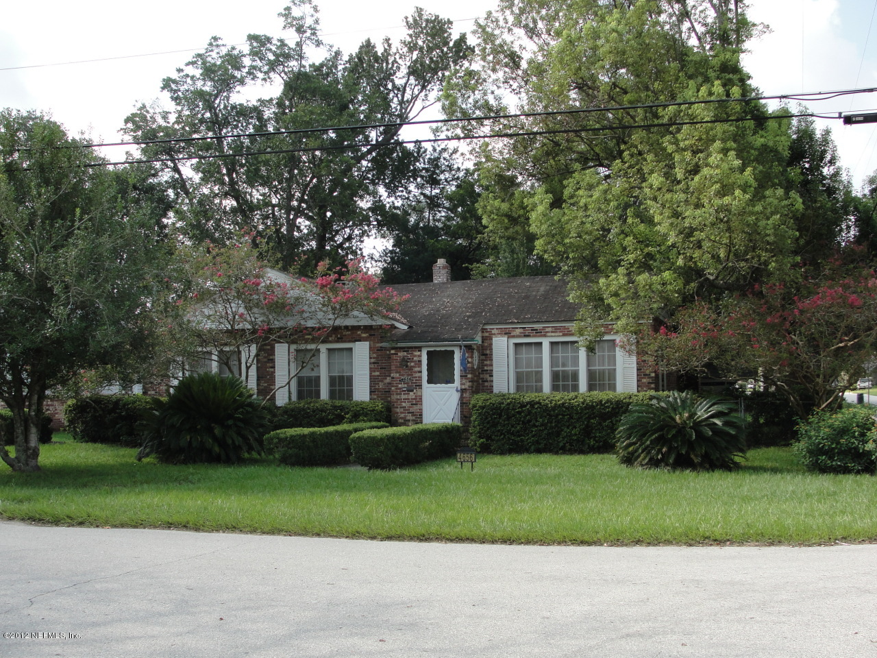 4656 Manchester Road Jacksonville, FL 32210 - Photo 29 of 31 a front view of a house with a garden