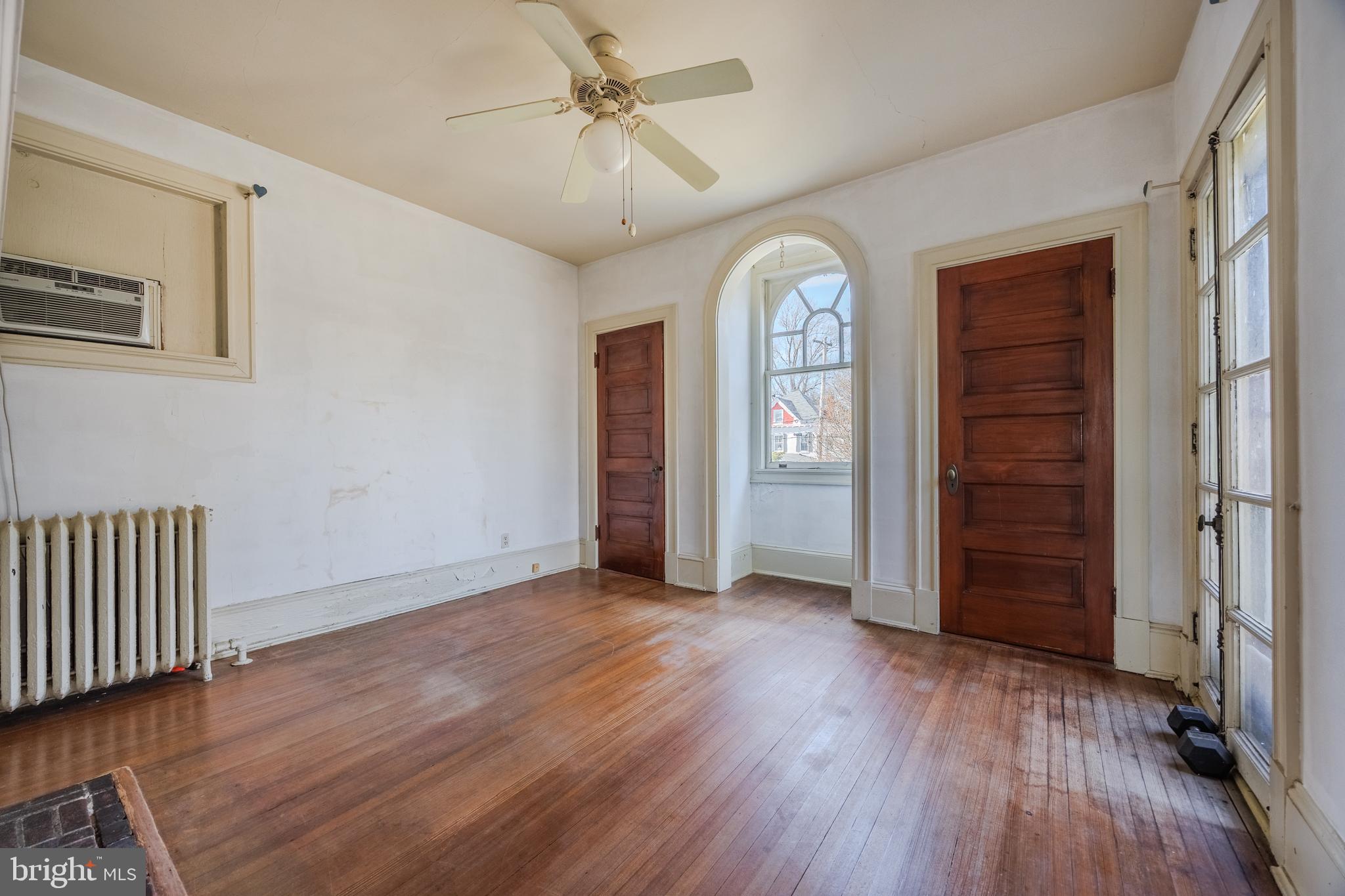 242 East Main Street Elkton, MD 21921 - Photo 29 of 53 an empty room with wooden floor closet and windows