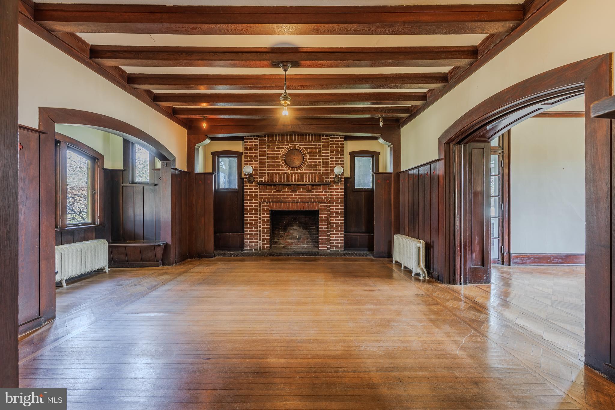 242 East Main Street Elkton, MD 21921 - Photo 7 of 53 a view of an empty room with wooden floor and a cabinet