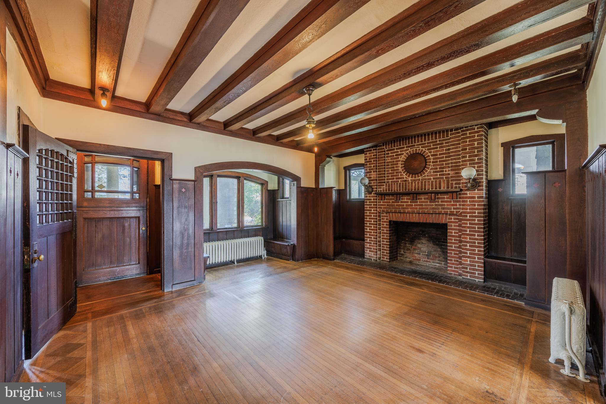 242 East Main Street Elkton, MD 21921 - Photo 8 of 53 a view of an empty room with wooden floor and a fireplace