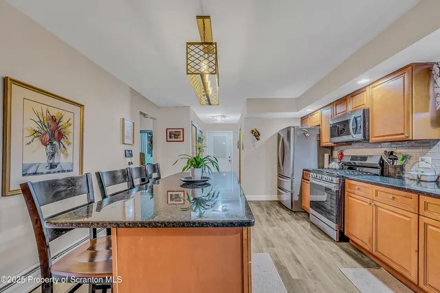 a kitchen with granite countertop lots of counter top space