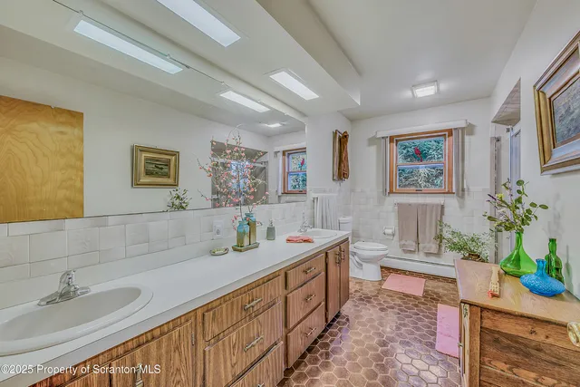 a bath room with a sink and a mirror