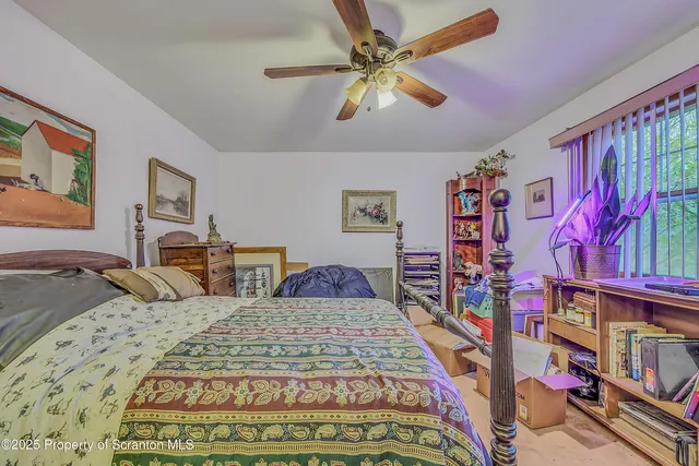 a bedroom with furniture and a rug