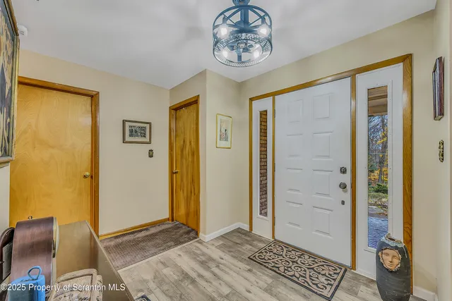 a view of an entryway with a chandelier