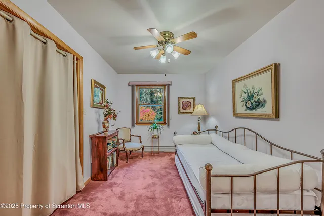 a very nice looking room with a large window and a chandelier