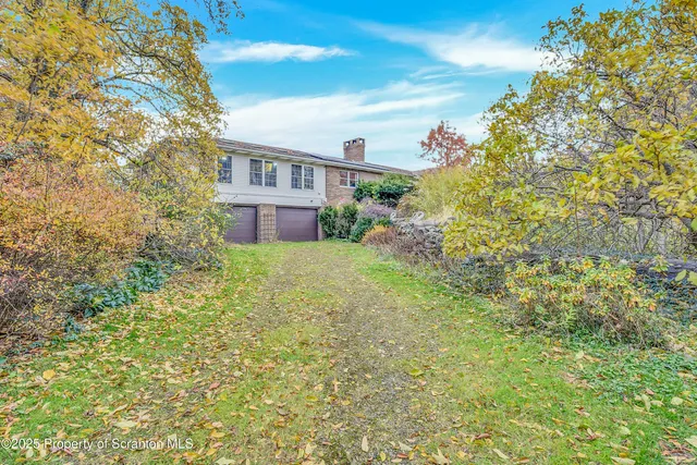 a view of a house with a garden