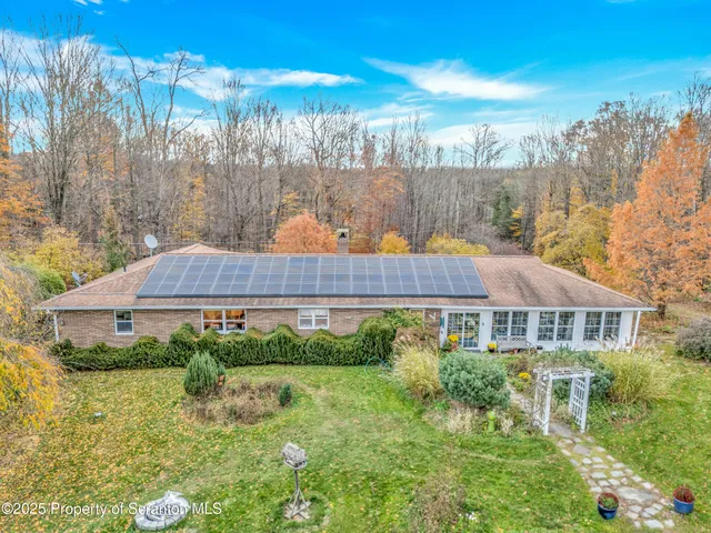a house view with a garden space