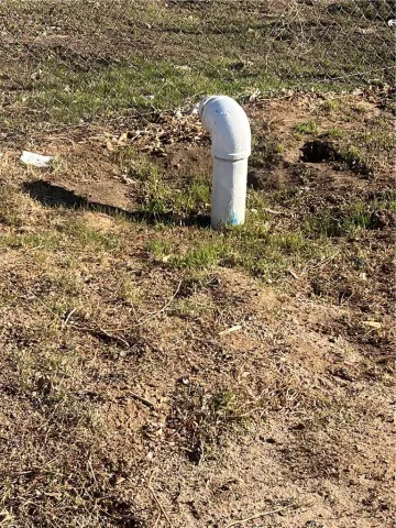 a view of a yard with an ocean view