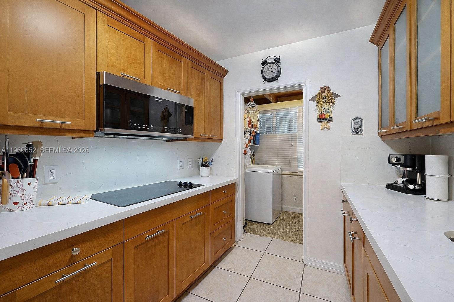 1611 Southwest 21st Street Miami, FL 33145 - Photo 14 of 59 a kitchen with a sink and a stove top oven