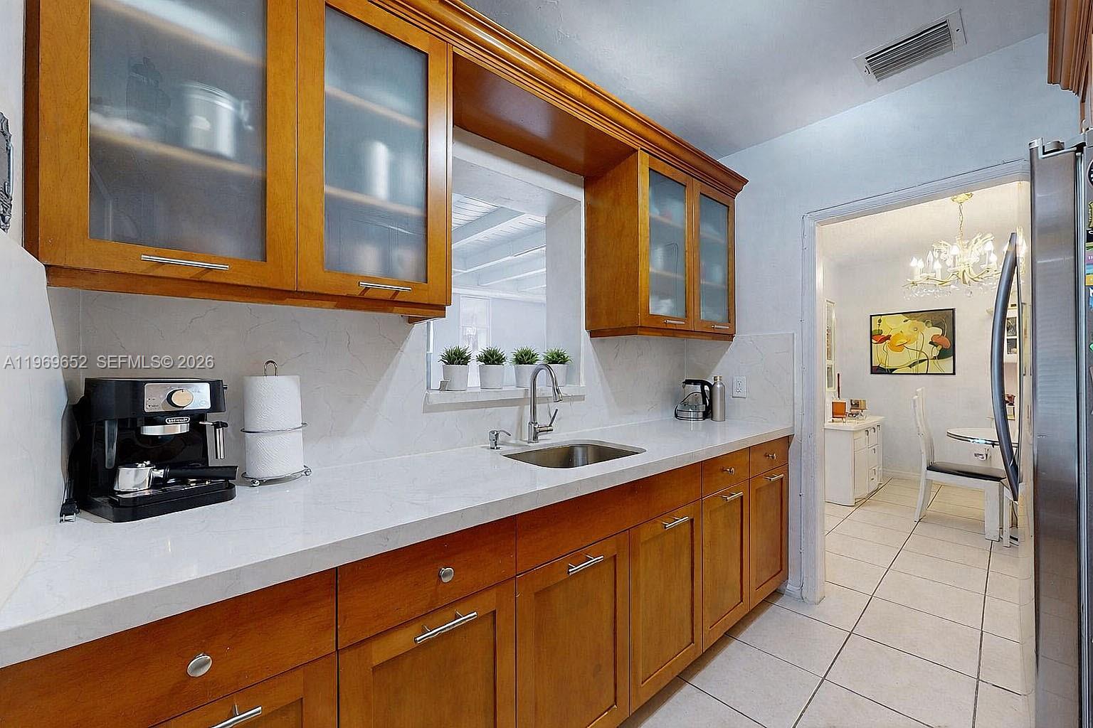 1611 Southwest 21st Street Miami, FL 33145 - Photo 15 of 59 a kitchen with a sink and cabinets
