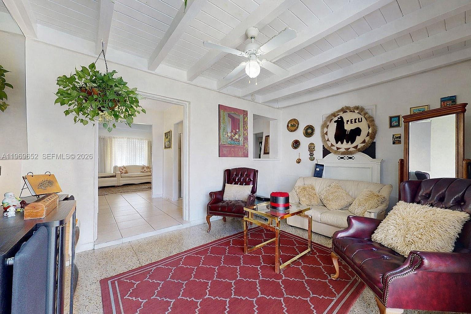 1611 Southwest 21st Street Miami, FL 33145 - Photo 17 of 59 a living room with furniture and a chandelier