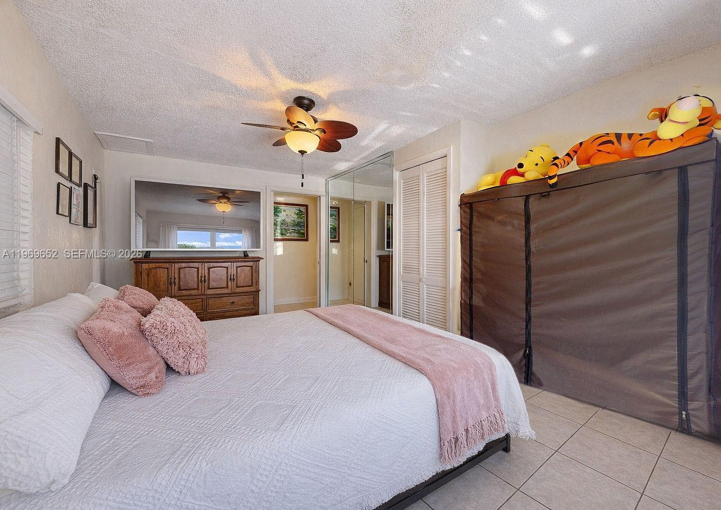 1611 Southwest 21st Street Miami, FL 33145 - Photo 25 of 59 a bedroom with a bed and a dresser