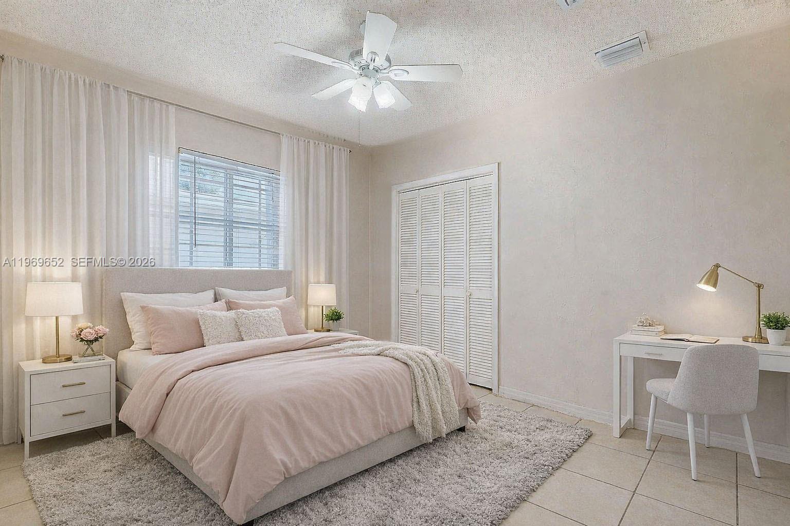 1611 Southwest 21st Street Miami, FL 33145 - Photo 31 of 59 a bedroom with a bed and a chair