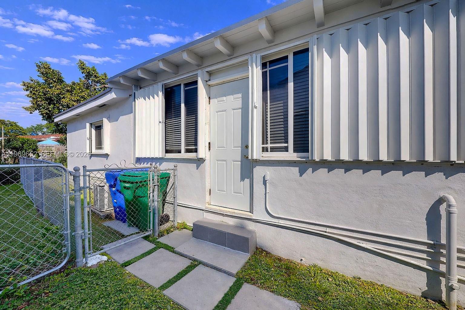 1611 Southwest 21st Street Miami, FL 33145 - Photo 37 of 59 a front view of a house with garden