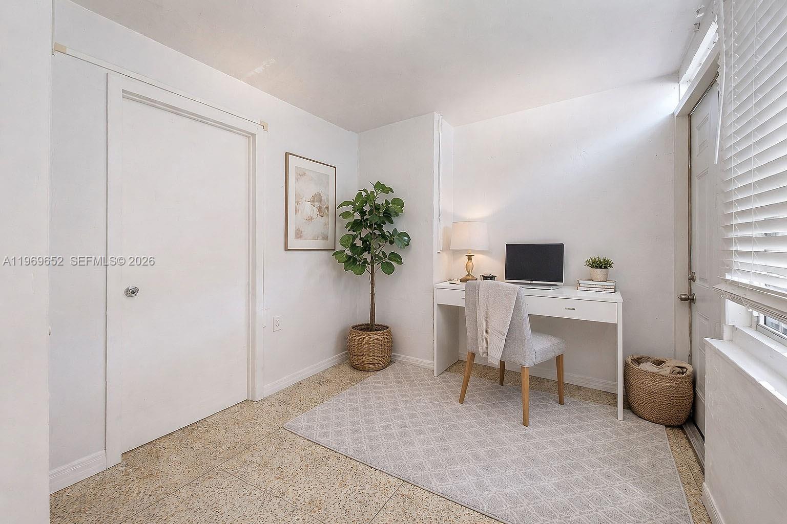 1611 Southwest 21st Street Miami, FL 33145 - Photo 39 of 59 a living room with furniture and a potted plant