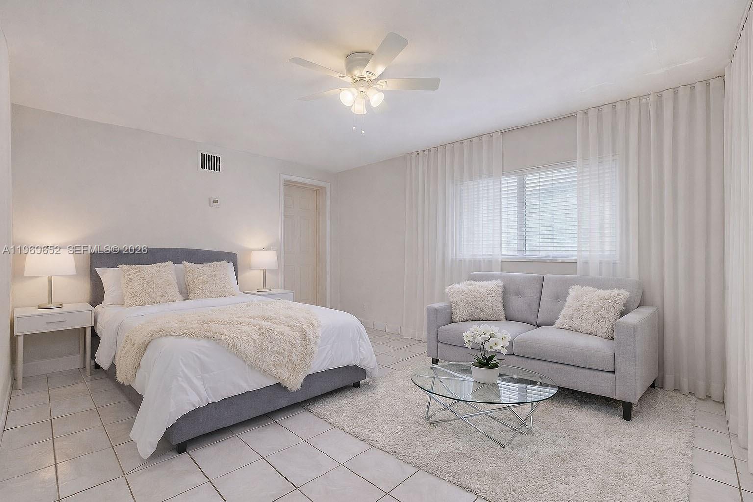 1611 Southwest 21st Street Miami, FL 33145 - Photo 42 of 59 a bedroom with a bed couches and window