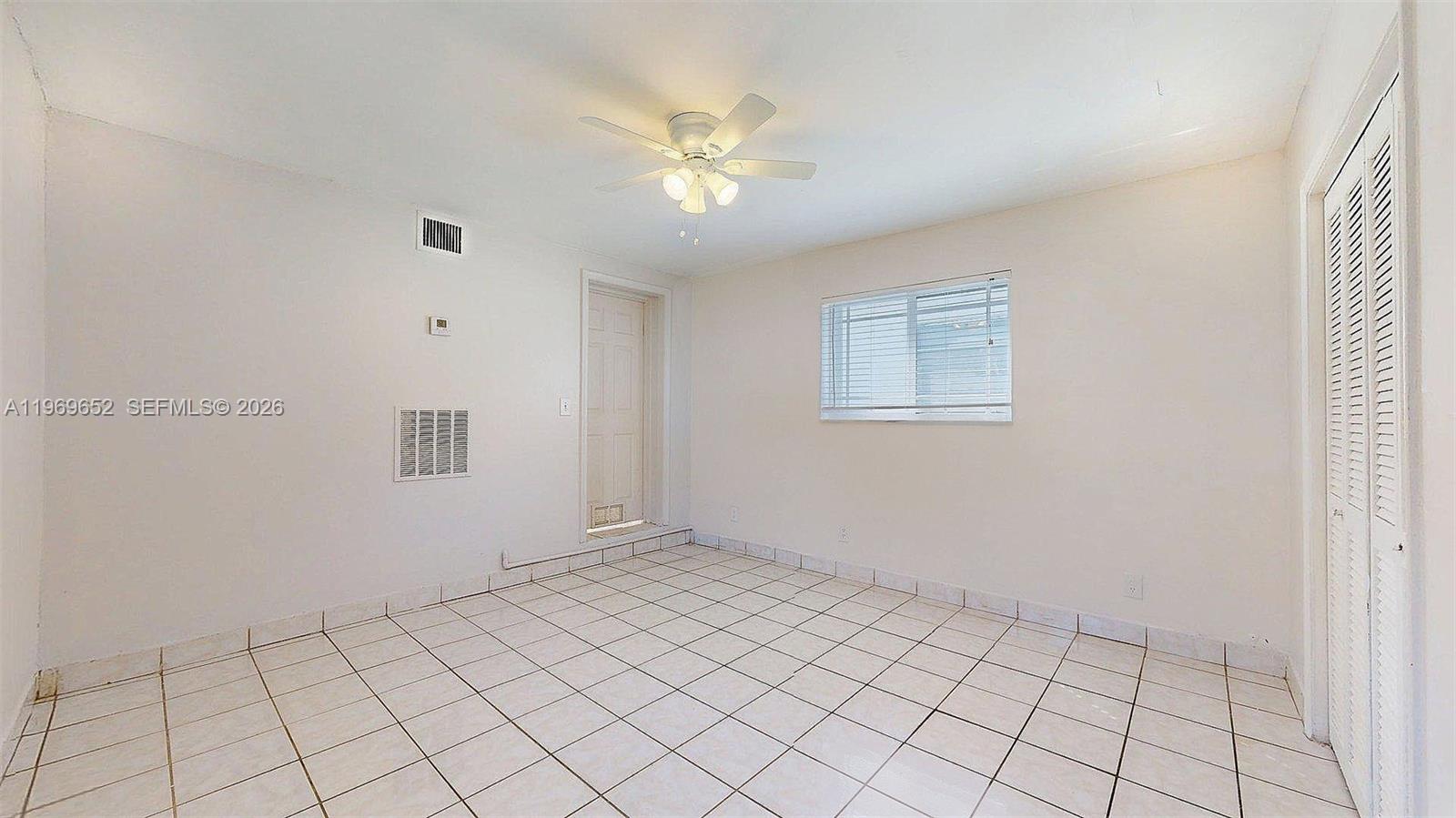 1611 Southwest 21st Street Miami, FL 33145 - Photo 43 of 59 a view of an empty room with a window