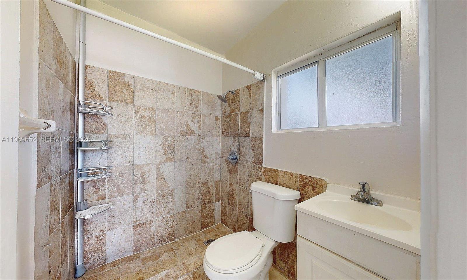 1611 Southwest 21st Street Miami, FL 33145 - Photo 49 of 59 a bathroom with a sink toilet and shower