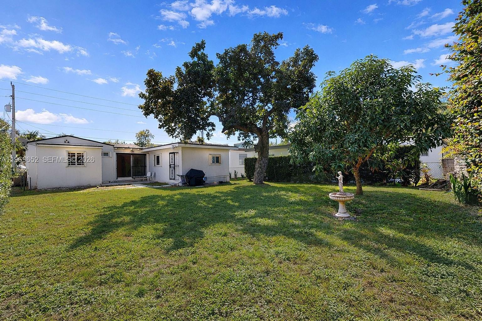 1611 Southwest 21st Street Miami, FL 33145 - Photo 54 of 59 a view of a house with a yard