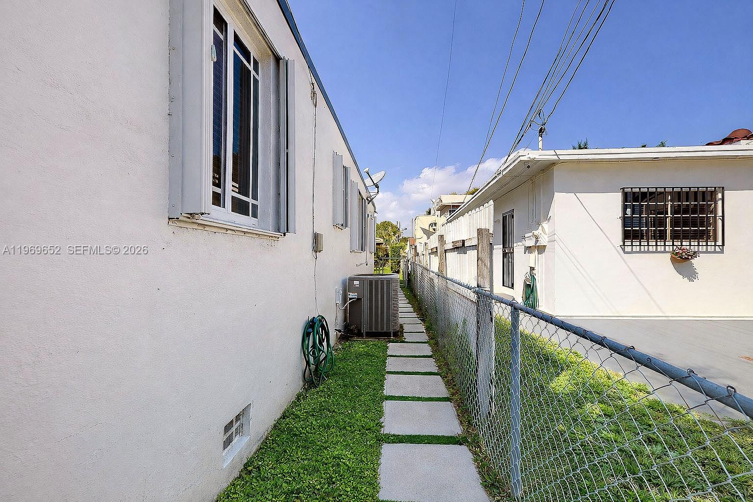 1611 Southwest 21st Street Miami, FL 33145 - Photo 57 of 59 a front view of a house with wooden stairs