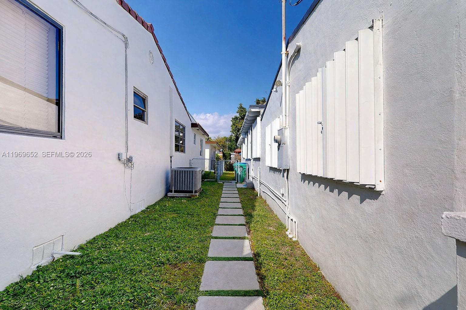 1611 Southwest 21st Street Miami, FL 33145 - Photo 58 of 59 a view of a pathway of a house with wooden floor