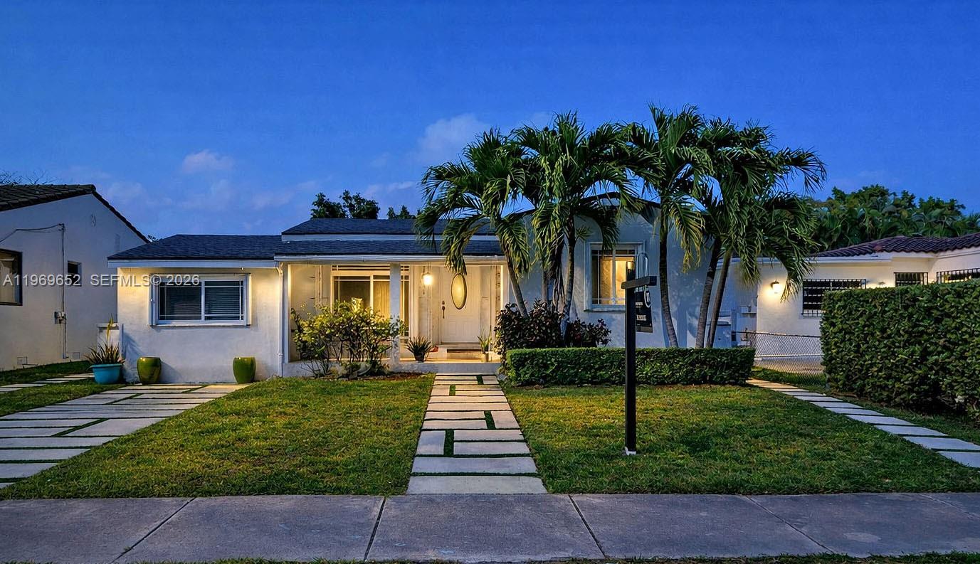 1611 Southwest 21st Street Miami, FL 33145 - Photo 59 of 59 a front view of a house with a yard