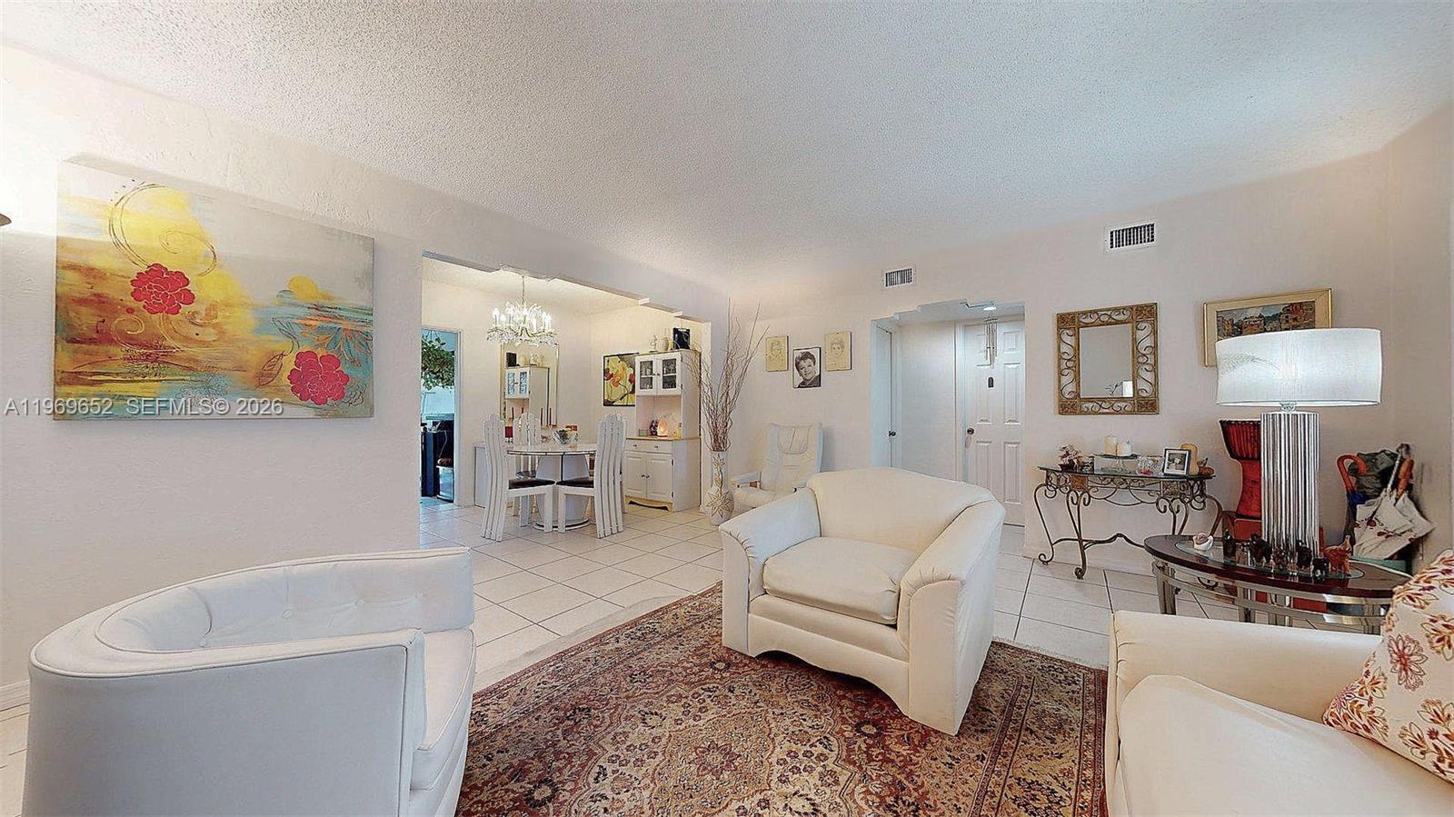 1611 Southwest 21st Street Miami, FL 33145 - Photo 9 of 59 a living room with furniture and a lamp