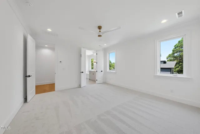 a bathroom with a double vanity sink mirror and shower