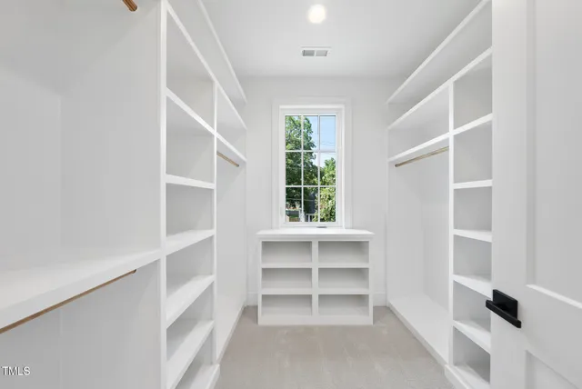 a bathroom with a sink vanity mirror bathtub and toilet