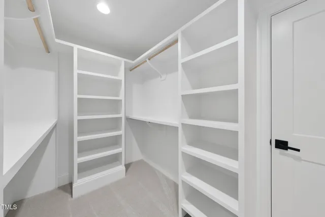 a bathroom with a sink vanity and mirror