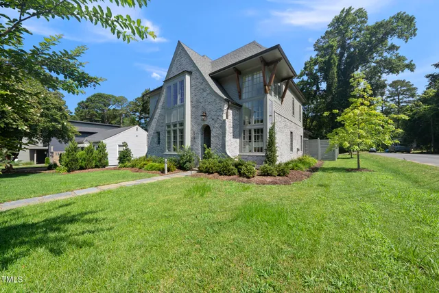 a view of staircase with wooden floor and a potted plant