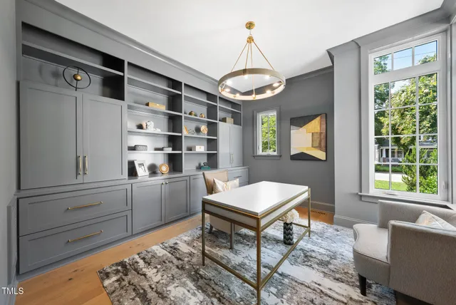 an empty room with windows and entrance