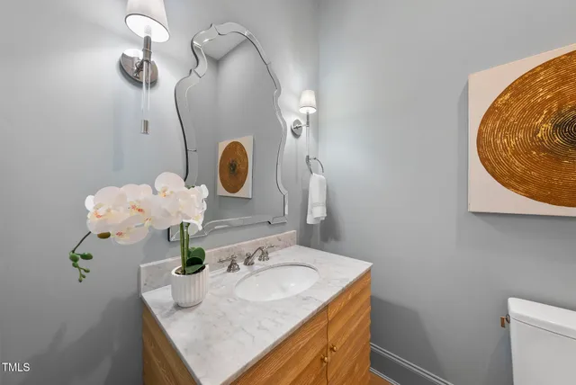 an empty room with a window and a ceiling fan